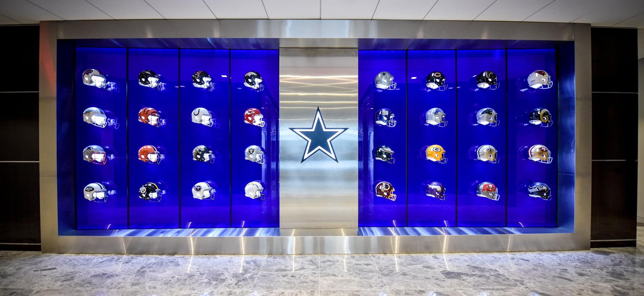 Football helmet display at The Star in Frisco