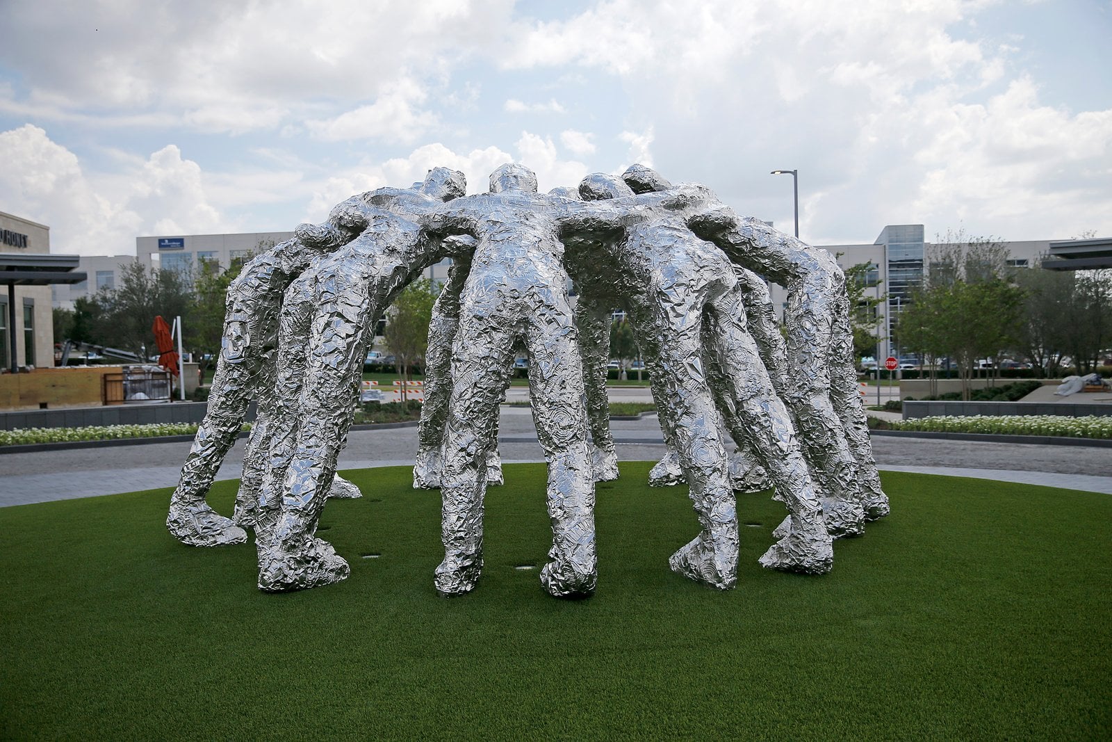 Sculpture depicting a football huddle at The Star
