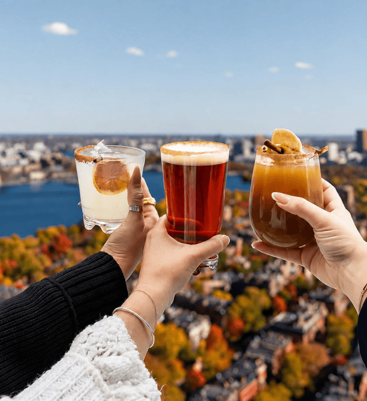 Cocktails raised in a toast at View Boston